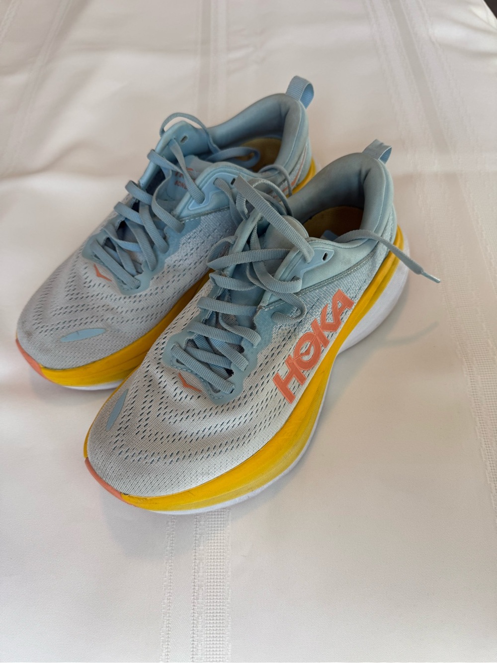 Hoka Women's Light Blue Running Shoes with Yellow Midsole and Coral Logo
